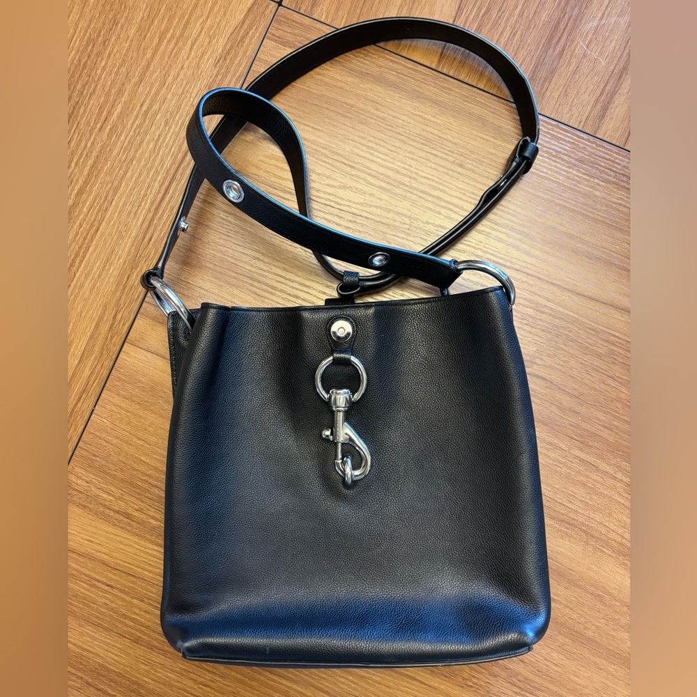 Rebecca Minkoff Megan small leather feed bag in black.